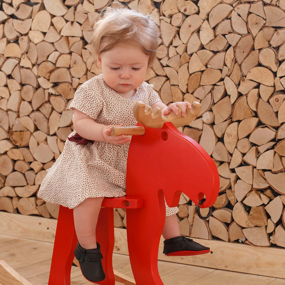 Fringe moccasins with red bottom